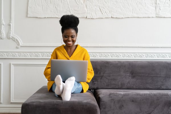 woman on sofa using voip